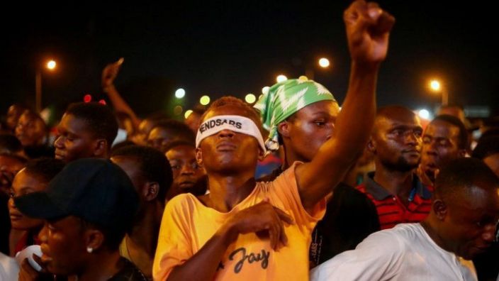 A demonstrator wearing a blindfold with an inscription &quot;End Sars&quot;, gestures during protest against alleged police brutality in Lagos, Nigeria October 17, 2020