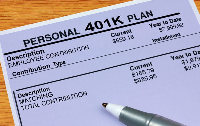 Pen resting on 401(k) plan statement