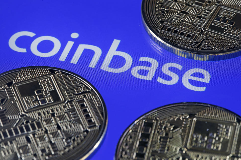 Digital cryptocurrency Bitcoin is displayed in front of the Coinbase cryptocurrency exchange platform logo. (Photo: Getty)