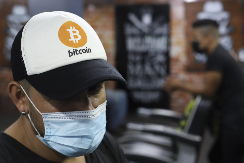 An employee wears a cap with the Bitcoin symbol at a barber shop in Santa Tecla, El Salvador. Photo: Salvador Melendez/AP
